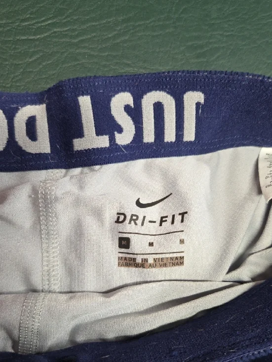 **Nike Women’s Purple Athletic Running Shorts with White Accents** - Picture 3 of 6